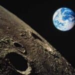 Планета Земля на фоне луной поверхности